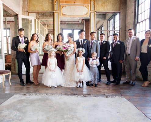 Wedding party group portrait on 3rd floor at Metropolitan Building in Long Island City, NY