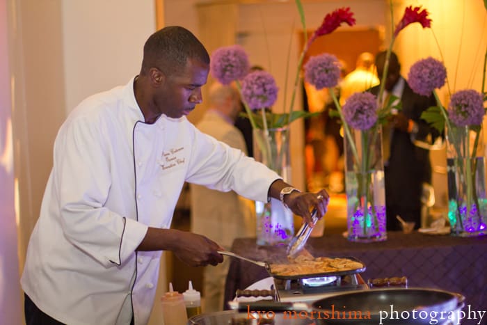 Chef Lucmann Pierre adds finishing touches at Geminis Give Back, photographed by Kyo Morishima.