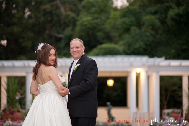 Bride and groom walk toward collonade at Shadowbrook in Shrewsbury, New Jersey, by NJ wedding photographer Kyo Morishima