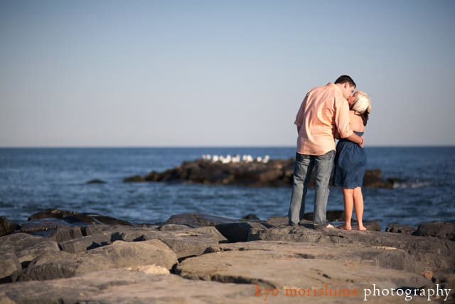 Engagement kiss on Asbury Park beach by NJ wedding photographer Kyo Morishima