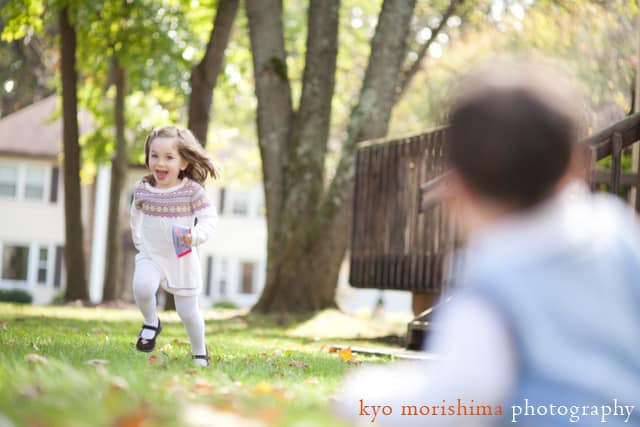 A little girl runs toward her brother; North Brunswick outdoor portrait by NJ family photographer Kyo Morishima