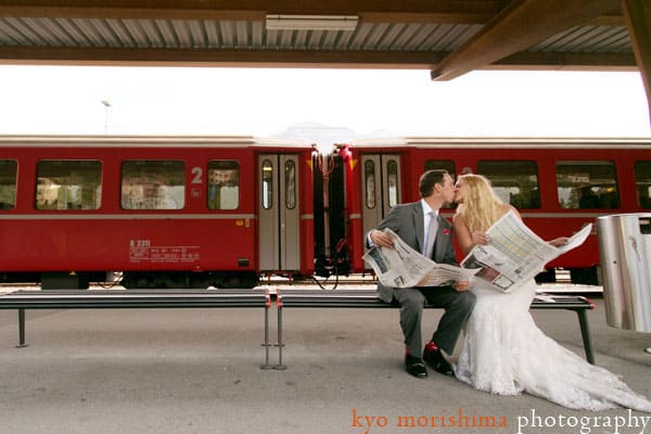 Bride and groom read newspaper in Switzerland, by destination wedding photographer Kyo Morishima