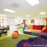 Renovated after-care room at a private school (Lovesac couch and beanbag, Armstrong Rave VCT floor tile, Flor "Made You Look" carpet tile, Ikea Abstrakt cabinetry), photographed by NJ documentary photographer Kyo Morishima.