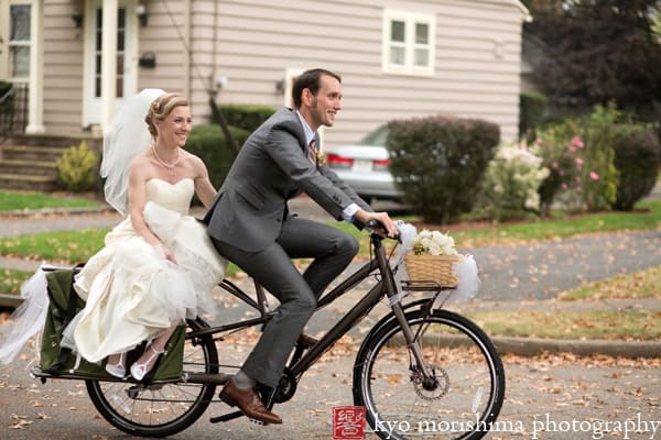 Bride and groom on bicycle after St Thomas the Apostle wedding ceremony, photographed by NJ wedding photographer Kyo Morishima.