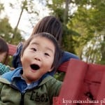 Excited boy on the hay ride at Von Thun Farms fall festival, by Metuchen family photographer Kyo Morishima