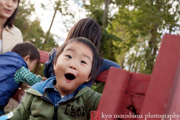 Excited boy on the hay ride at Von Thun Farms fall festival, by Metuchen family photographer Kyo Morishima