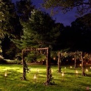 Candles light the path to a backyard wedding designed by Food Company Catering, photographed by Kyo Morishima