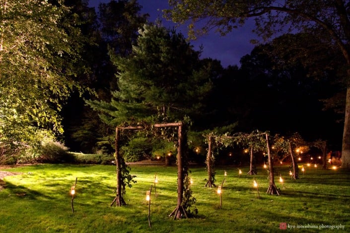 Candles light the path to a backyard wedding designed by Food Company Catering, photographed by Kyo Morishima