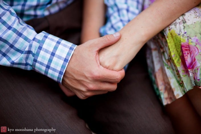 Holding hands at rehearsal dinner, photographed by Lake Geneva wedding photographer Kyo Morishima