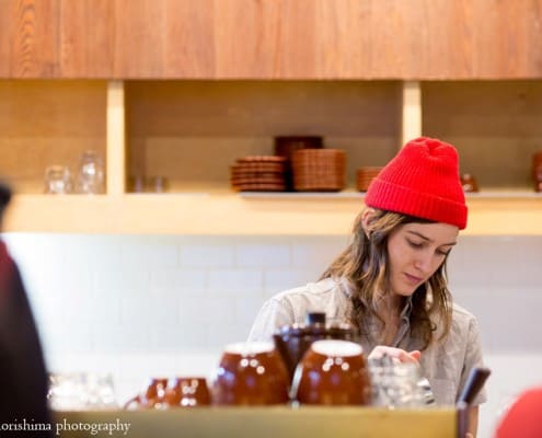 Barista with red hat at Blue Bottle Coffee in Williamsburg, photographed by Kyo Morishima