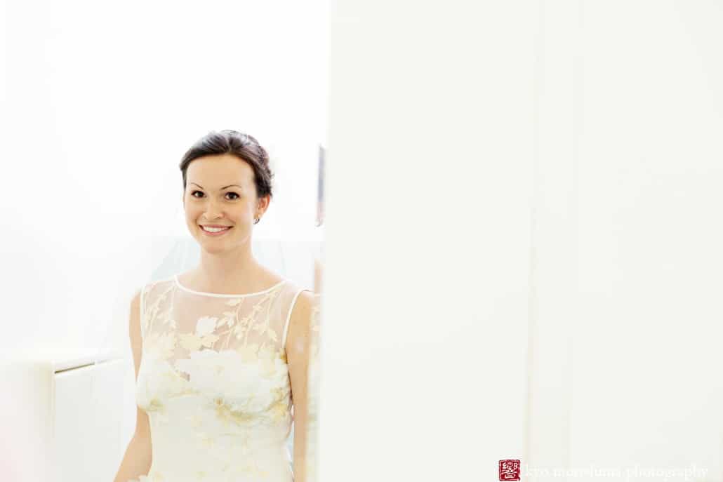 A bride emerges after getting ready, photographed by Hamilton wedding photographer Kyo Morishima