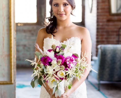 Bride with bouquet of fuschia peonies and white astilbe from Flower Muse, designed by Krystle DeSantos, photographed by Kyo Morishima