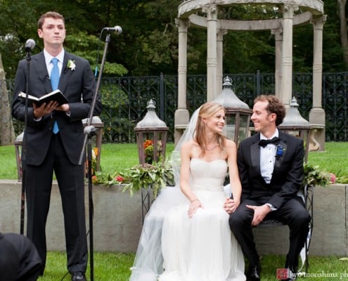 Bride and groom look at each other and smile during Jasna Polana wedding ceremony, photographed by Kyo Morishima