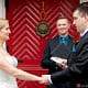 Bride and groom in front of Nassau Inn red door, photographed by Princeton wedding photographer Kyo Morishima