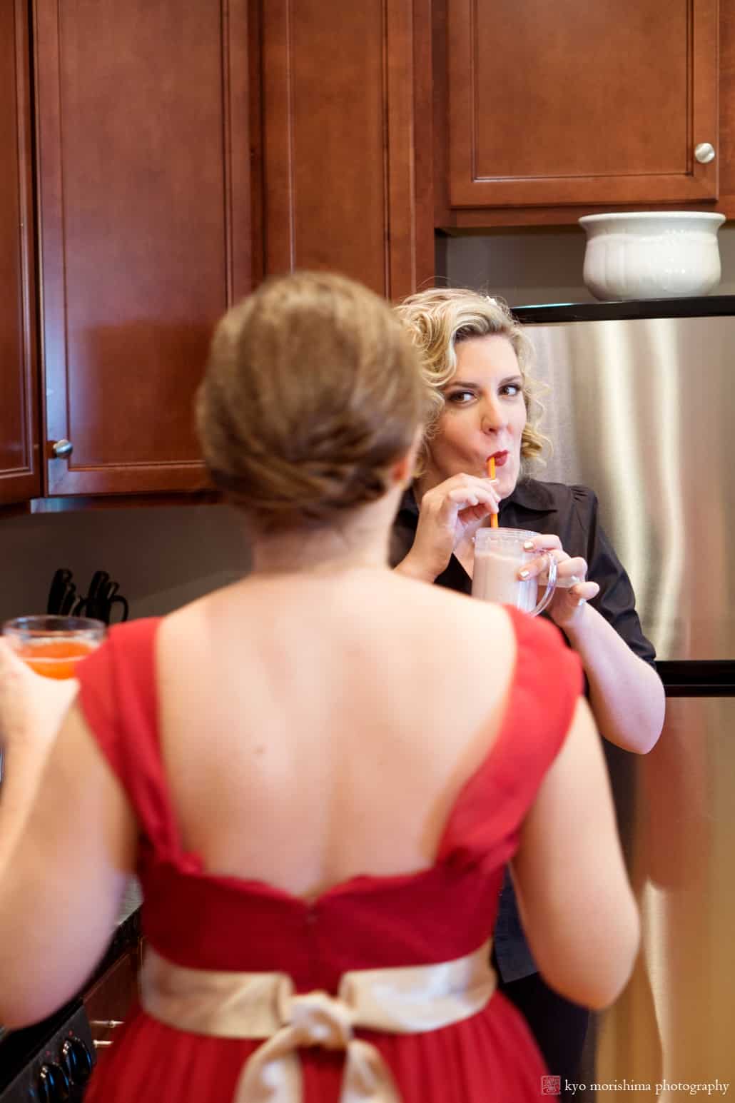 Bride sips a cocktail while getting ready at Westin Princeton Forrestal Village, photographed by Kyo Morishima