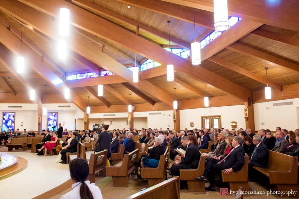 Wedding guests watch ceremony at Queenship of Mary Church in Plainsboro, photographed by Kyo Morishima