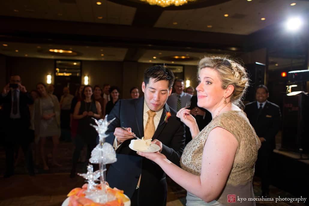 Bride makes a face after cake cutting at Westin Princeton wedding, photographed by Kyo Morishima