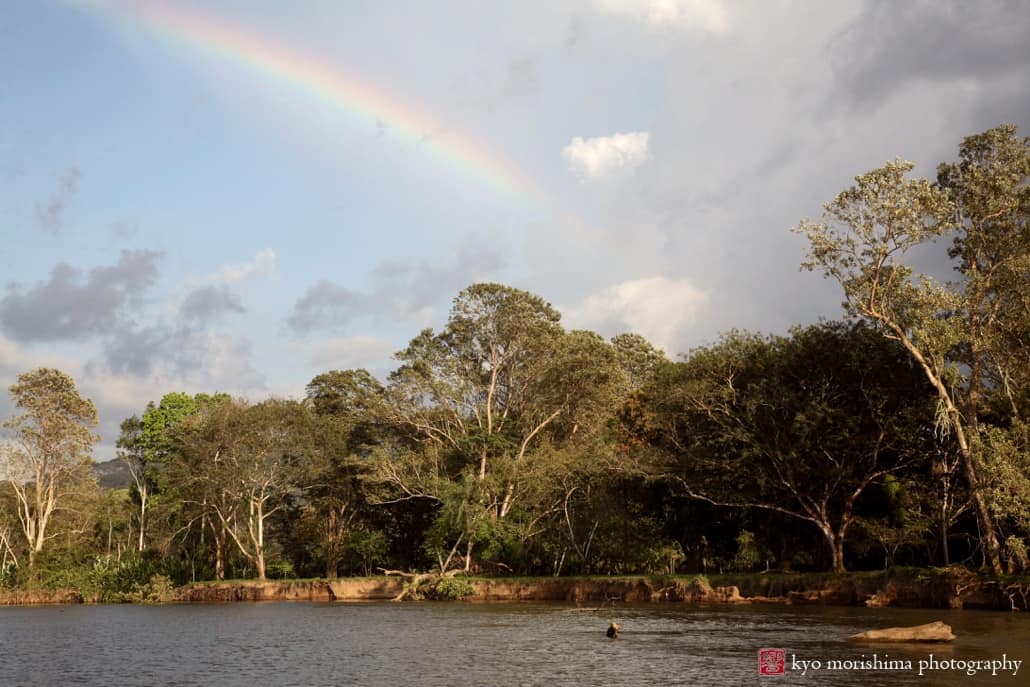 Rainbow over river in Costa Rica, photographed by Kyo Morishima