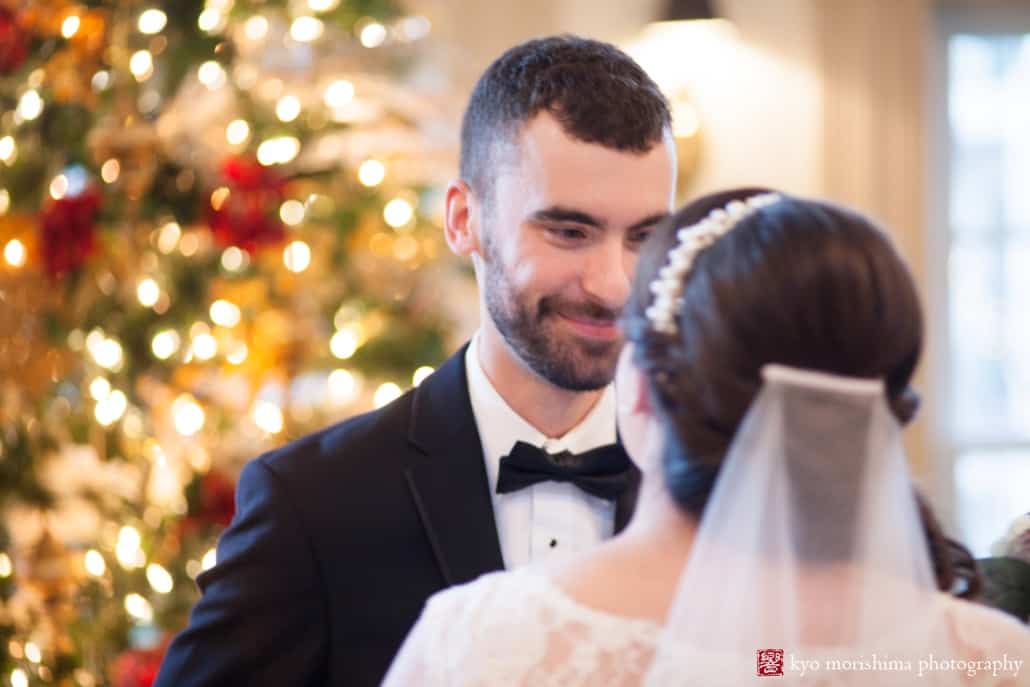 Groom smiles at bride as he sees her for the first time before Olde Mill Inn wedding, photographed by Kyo Morishima