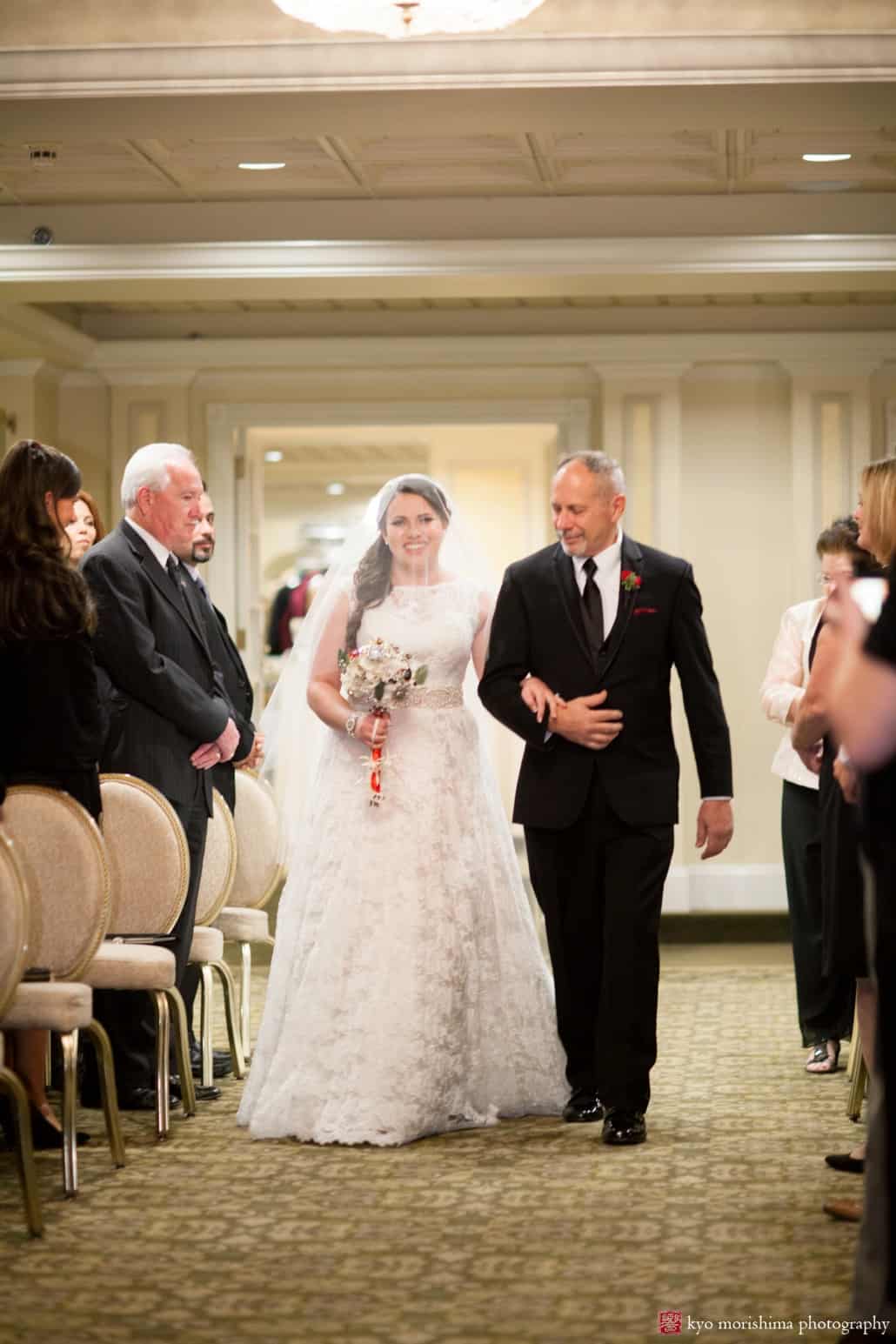 Father and bride walk down the aisle at Olde Mill Inn Christmas wedding, photographed by Kyo Morishima