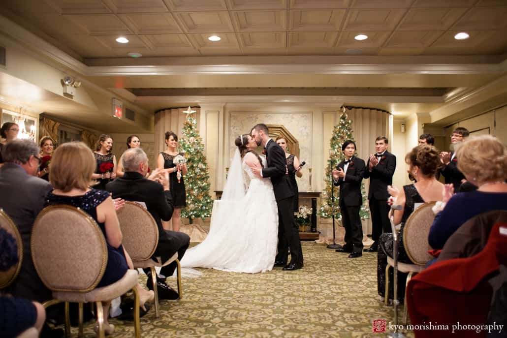 Bride and groom kiss as wedding ceremony ends at Olde Mill Inn wedding photographed by Kyo Morishima