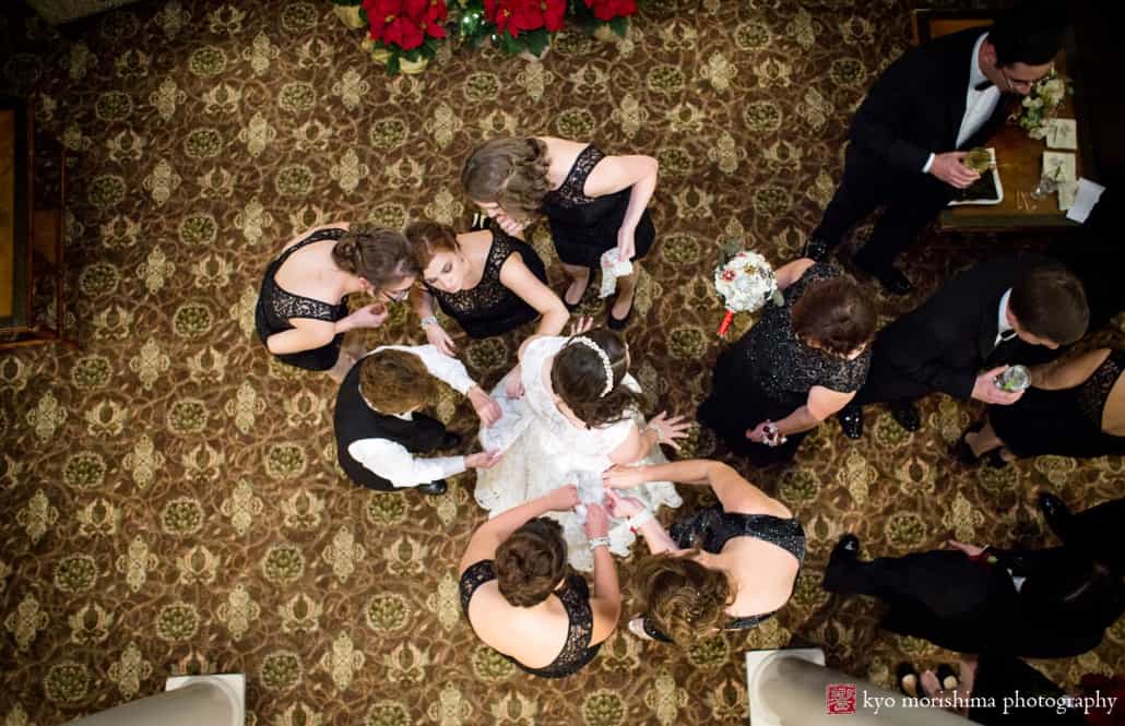 Bridesmaids touch up bride after ceremony at Olde Mill Inn, photographed by Kyo Morishima