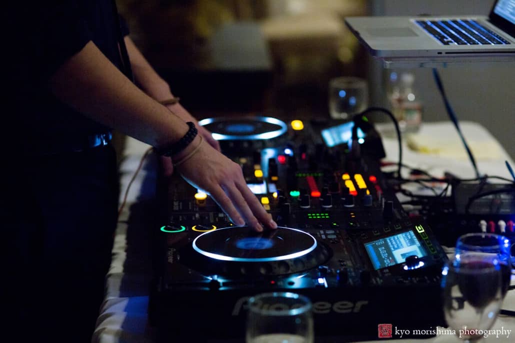 DJ from Elegant Ensembles mixes music, photographed by Kyo Morishima