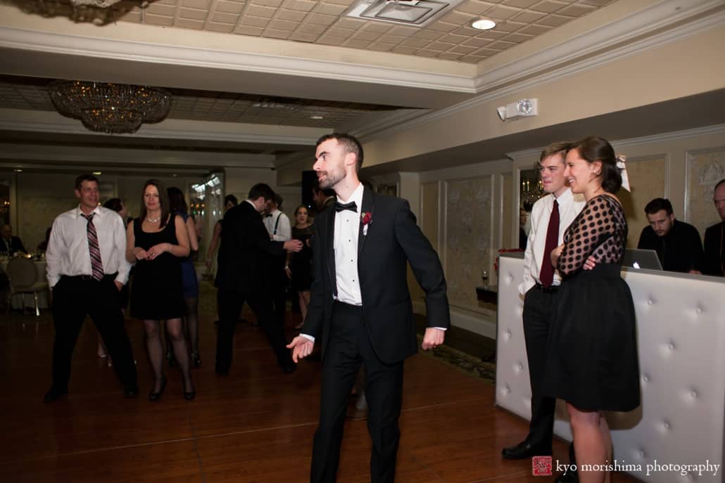 Groom poses on the dance floor at Olde Mill Inn wedding, photographed by Kyo Morishima