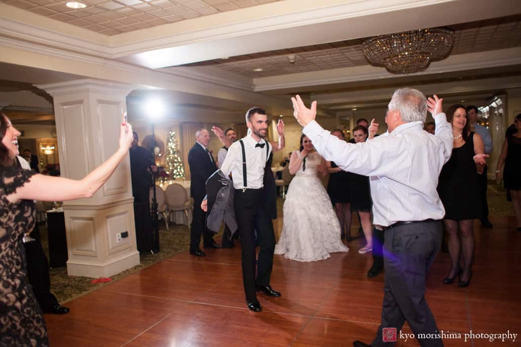 Groom and wedding guest face off on the dance floor at Olde Mill Inn, photographed by Kyo Morishima