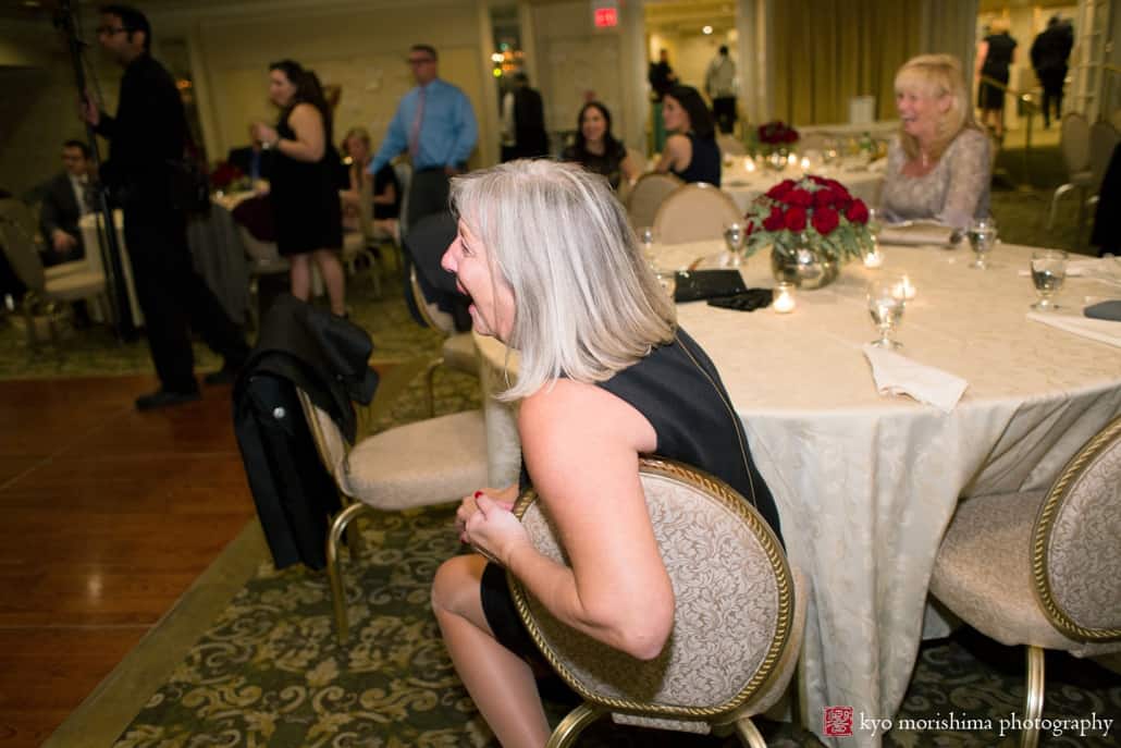 Guest laughs at Olde Mill Inn wedding, photographed by Kyo Morishima