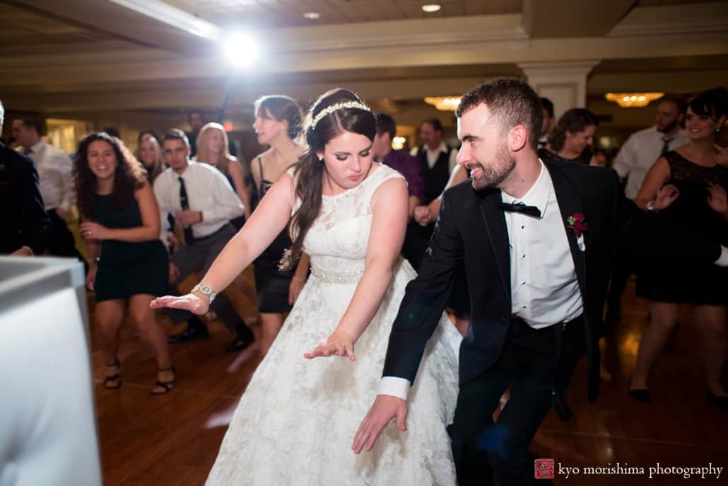 Bride and groom ready to take off on Olde Mill Inn wedding dance floor, photographed by Kyo Morishima