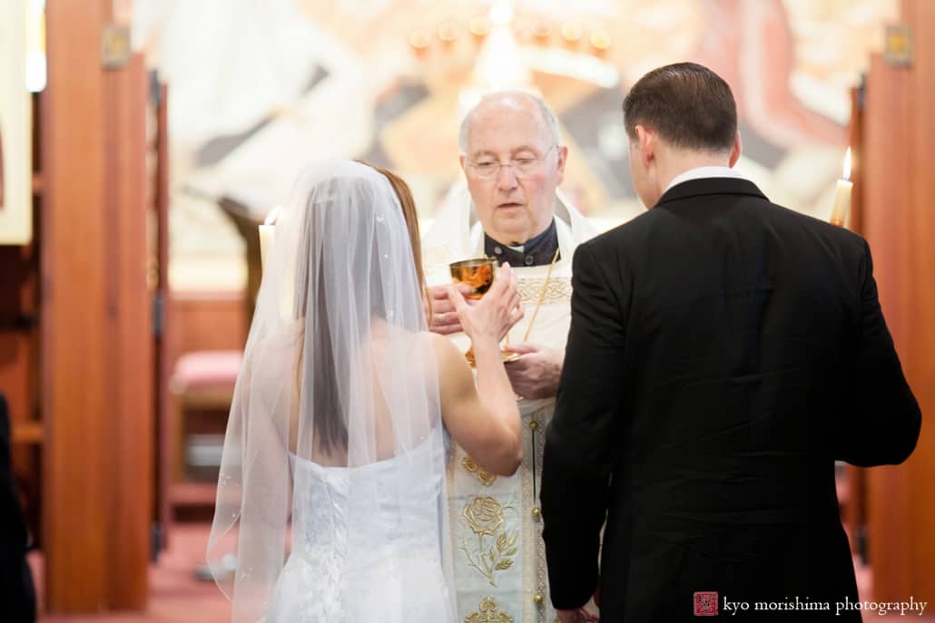 Bride and groom at the altar during Holy Resurrection Orthodox Church wedding photographed by Kyo Morishima