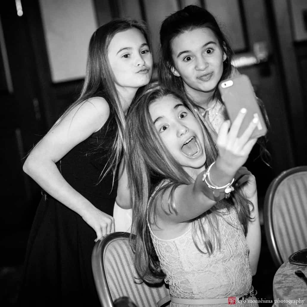Three girls take a selfie during Nassau Inn wedding reception, photographed by NJ photojournalistic wedding photographer Kyo Morishima