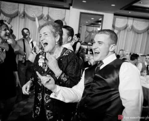 Grandmother and grandson dance together during Nassau Inn wedding, photographed by Kyo Morishima