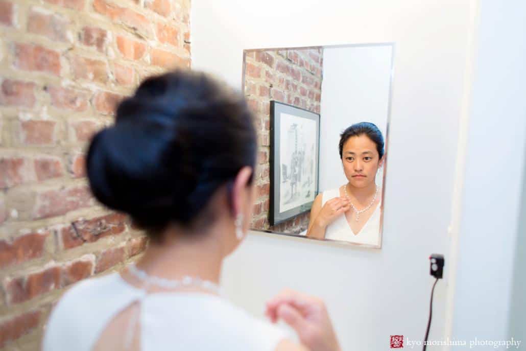 Bride prepares for wedding in an Airbnb studio owned by The Invisible Dog Art Center, photographed by Kyo Morishima