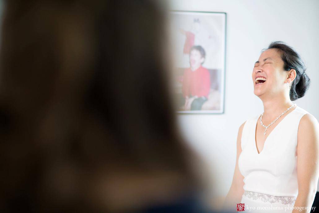 Bride laughs as she gets ready for wedding at a Boerum Hill Airbnb, photographed by Kyo Morishima