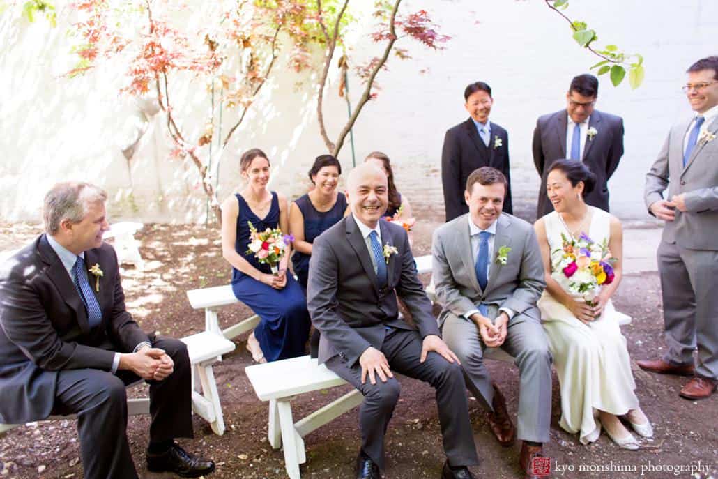 Bride and groom relax with guests before wedding ceremony at Invisible Dog Art Center, photographed by Kyo Morishima