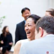 Bride laughs during Invisible Dog wedding ceremony, photographed by Boerum HIll wedding photographer Kyo Morishima