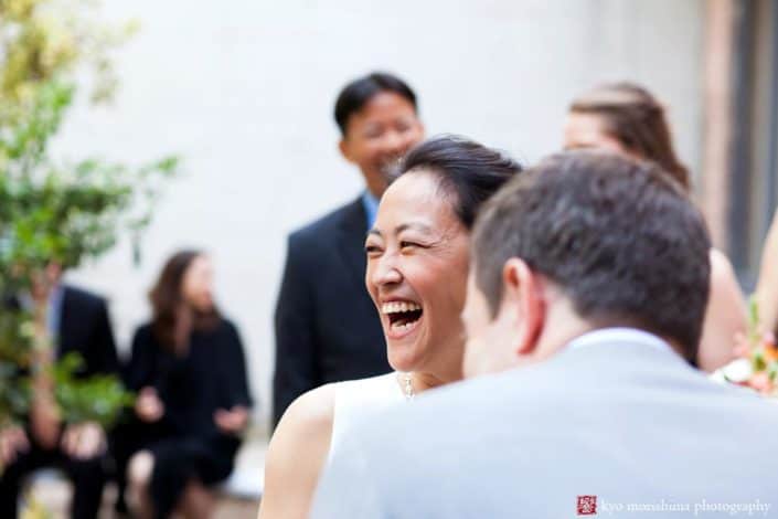 Bride laughs during Invisible Dog wedding ceremony, photographed by Boerum HIll wedding photographer Kyo Morishima