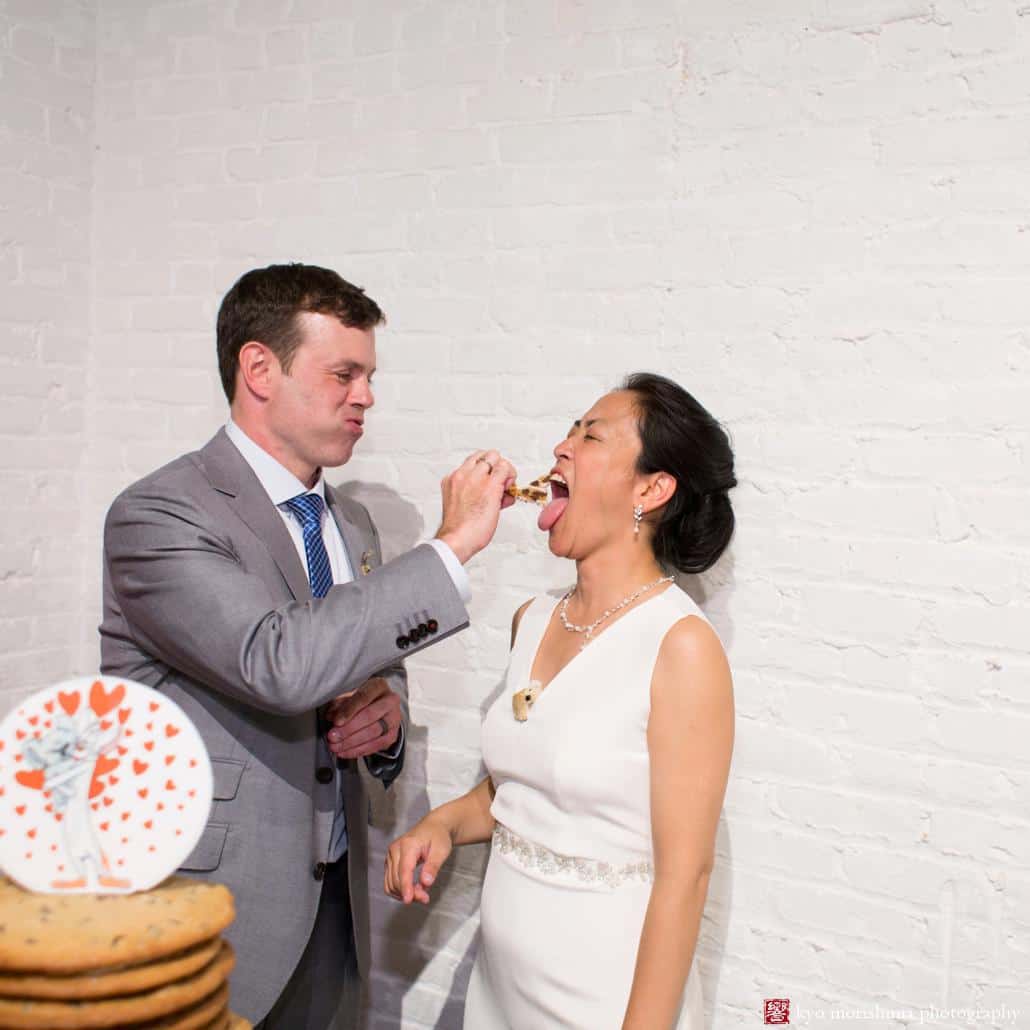 Bride and groom eat chocolate chip cookie wedding cake by Naidre's Cafe and Bakery in Park Slope, photographed by Kyo Morishima