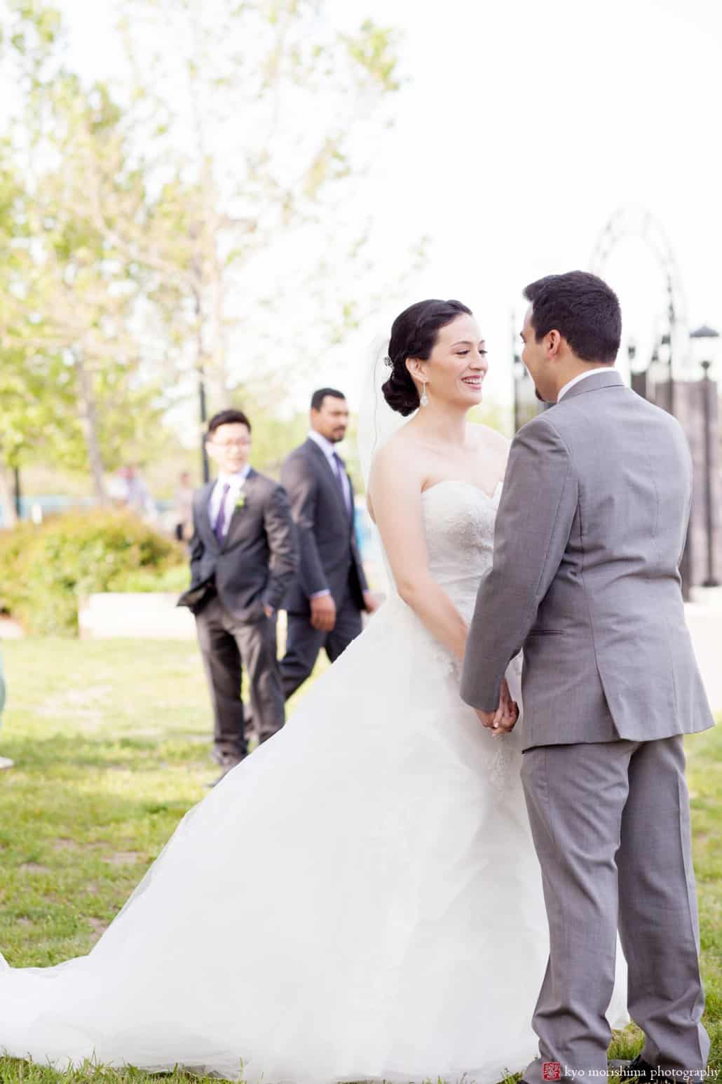 Wedding portrait at Weehawken Waterfront Park with groomsmen in background, photographed by Kyo Morishima