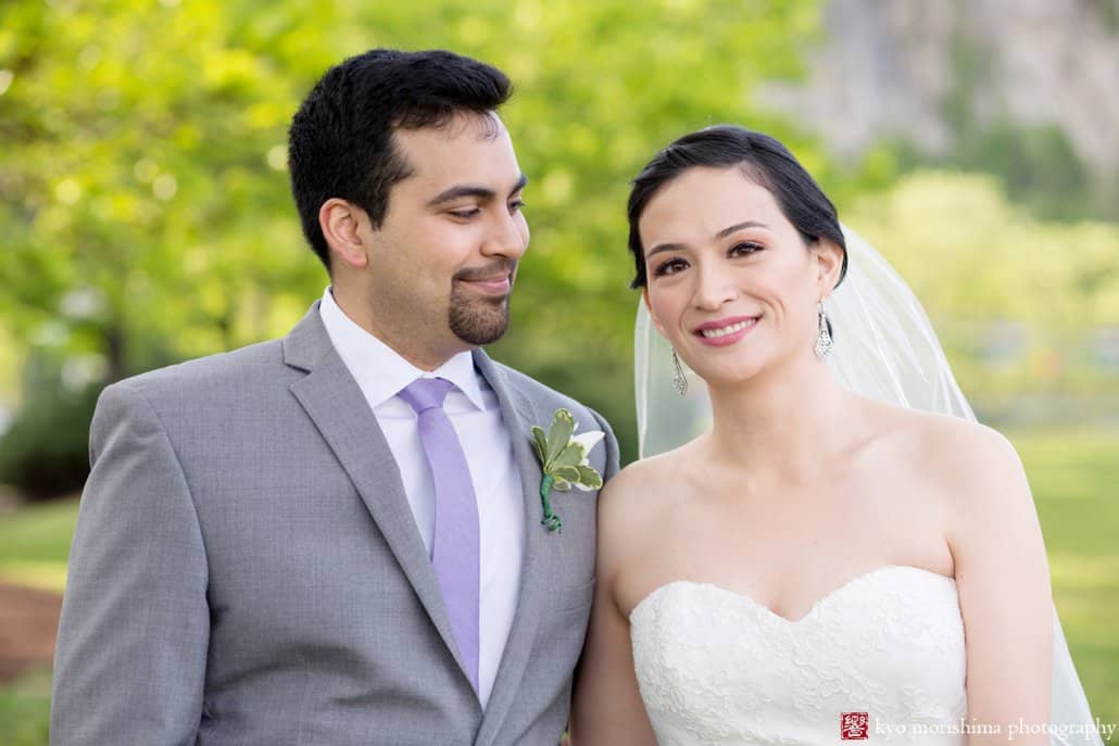 Groom smiles at bride during wedding portrait at Weehawken Waterfront Park, photographed by Kyo Morishima