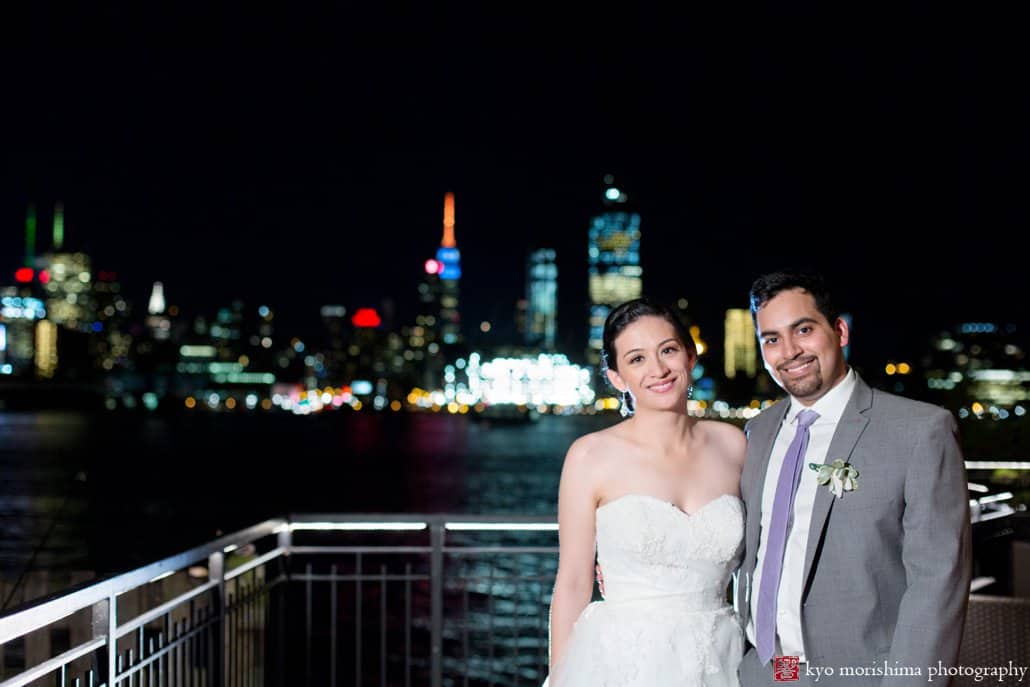Chart House wedding portrait with night view of Manhattan in the background, photographed by Kyo Morishima