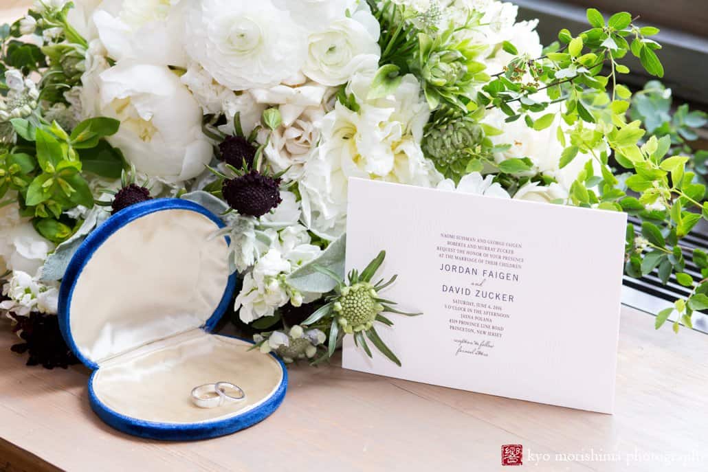 Detail shot of invitation by Joy Cards with wedding rings and flowers by Katherine Toland of Greystone Designs, photographed by Princeton wedding photographer Kyo Morishima