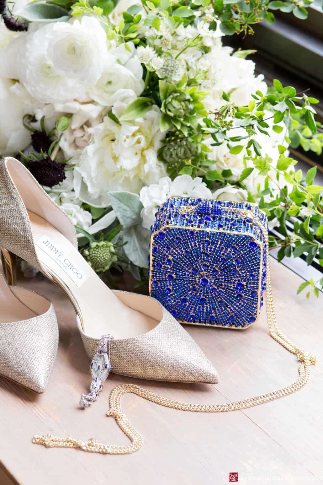 Wedding shoes and evening bag with flowers by Katherine Toland behind them, photographed by Kyo Morishima