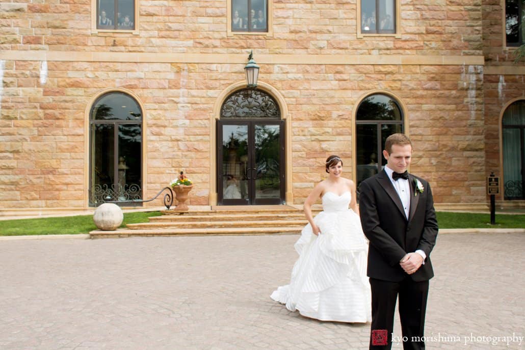 Bride approaches groom for first look in Jasna Polana courtyard, photographed by Kyo Morishima