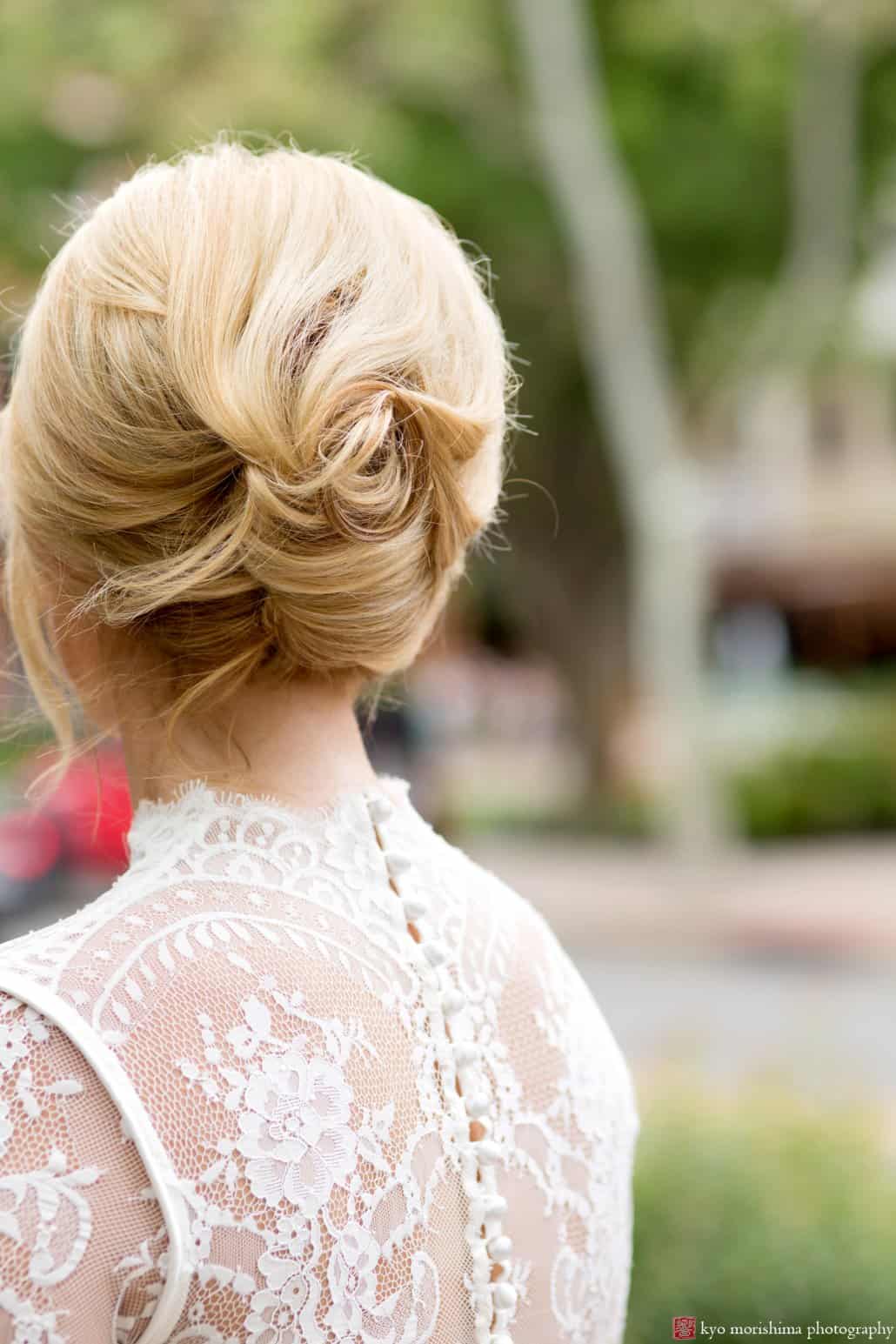 Bride with 1960s style updo by Letitia Kakas, detail of back of BHLDN Bridgette wedding dress, photographed by Kyo Morishima