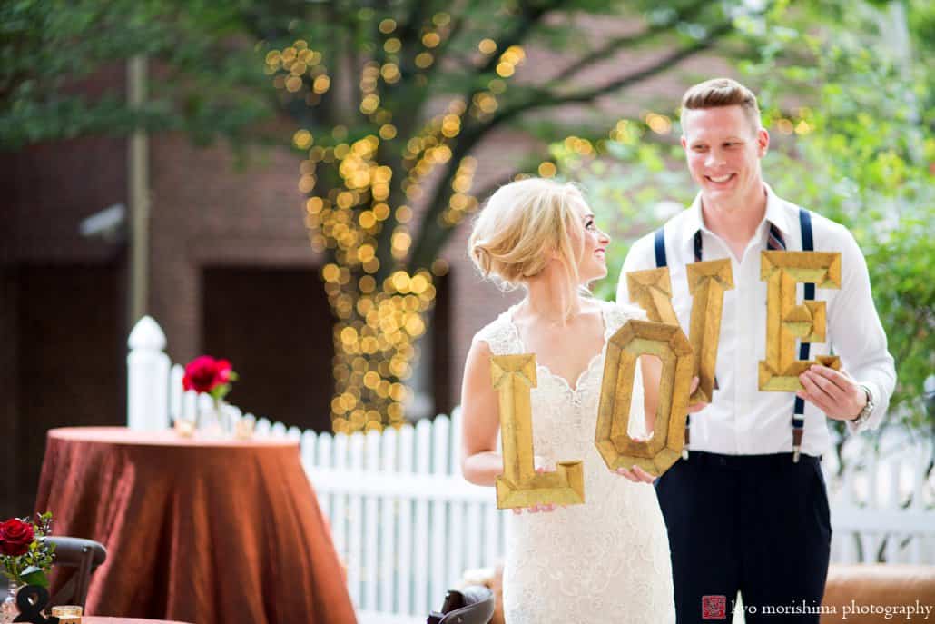 Bride and groom holding 