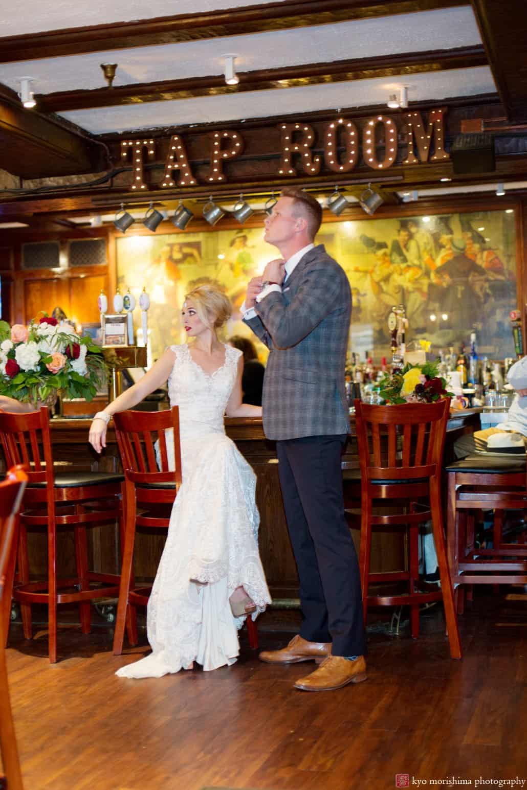 Bride and groom in Nassau Inn's Yankee Doodle Tap Room during 