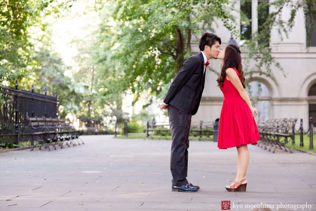 Japanese engagement photo in NYC near City Hall, with woman wearing a red dress. photographed by Kyo Morishima